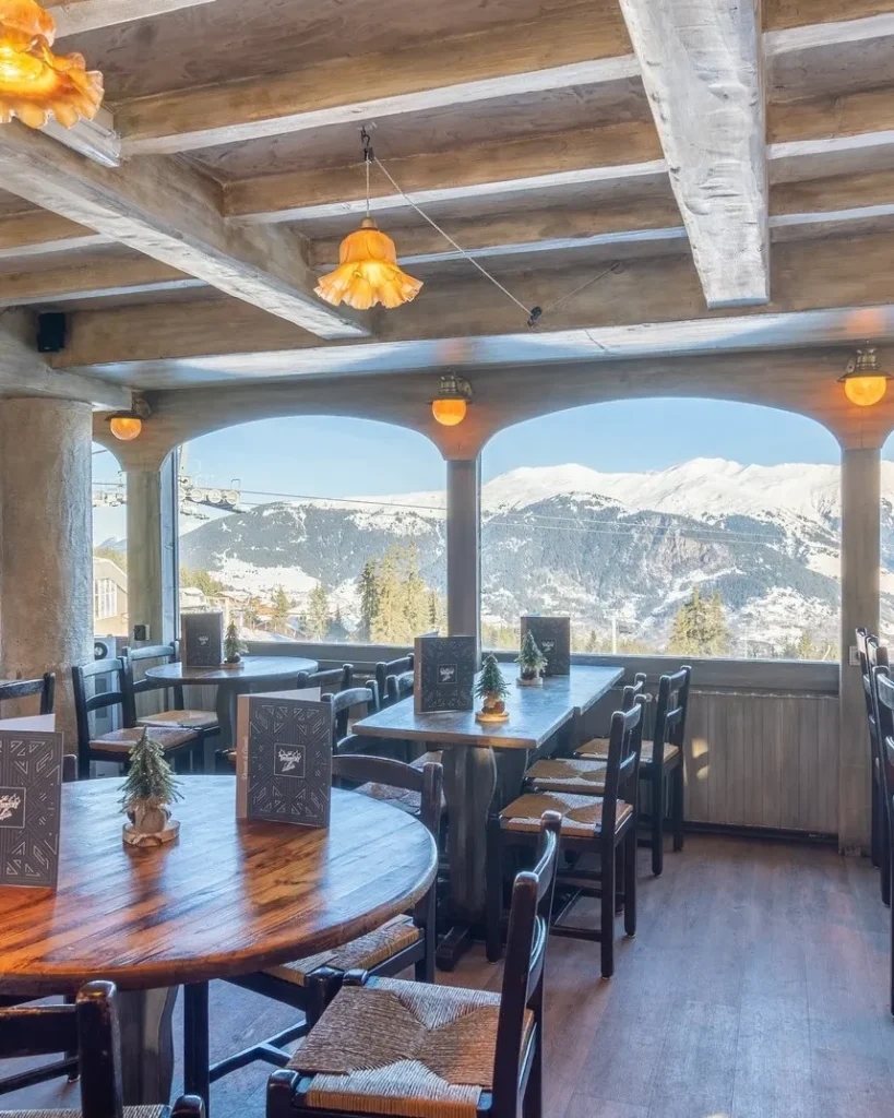 Bright dining area at Le Tremplin Courchevel with mountain views