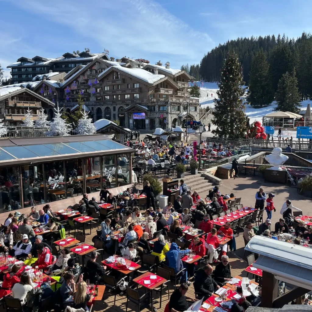 Busy outdoor dining terrace at Le Tremplin Courchevel in Courchevel