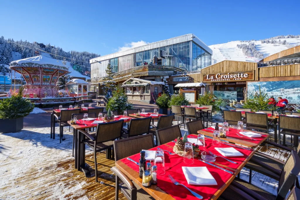 Outdoor dining terrace at Le Tremplin Courchevel with mountain views