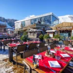 Outdoor dining terrace at Le Tremplin Courchevel with mountain views