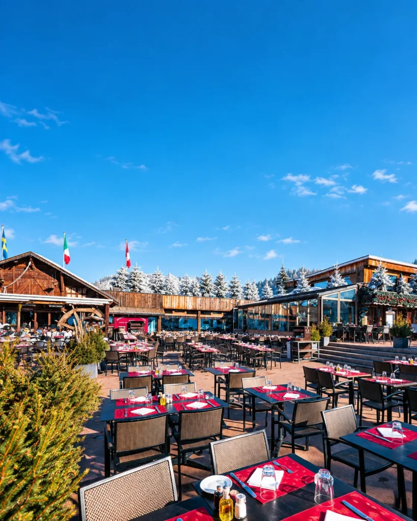 Outdoor terrace dining at Le Tremplin Courchevel under a clear blue sky
