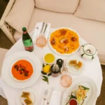 Breakfast dishes and drinks arranged at Loulou Paris