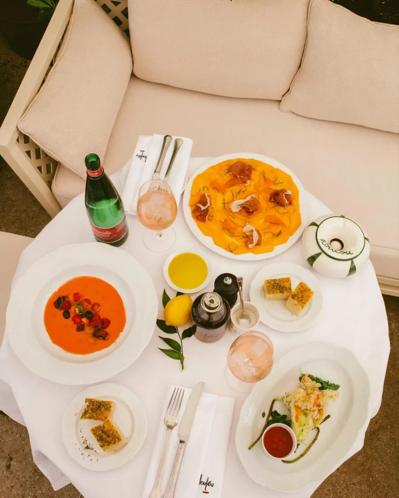 Breakfast dishes and drinks arranged at Loulou Paris
