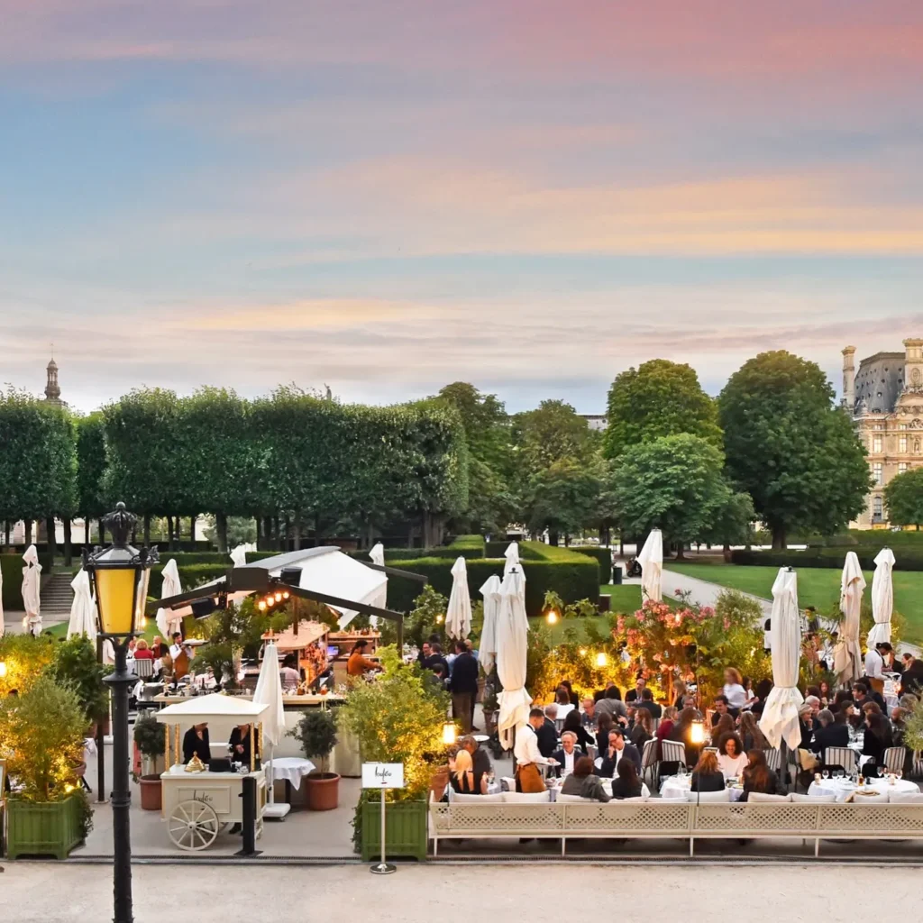 Loulou Paris garden terrace filled with outdoor diners