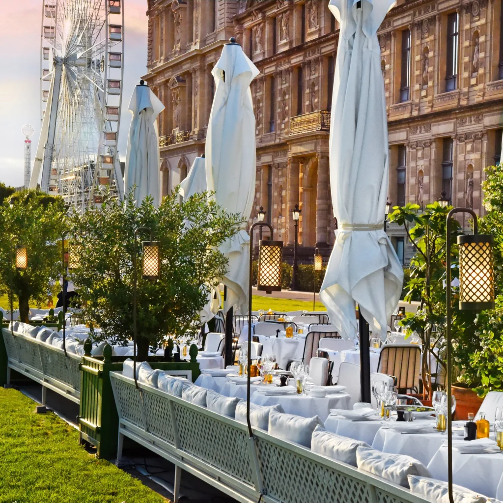 Outdoor terrace seating beside the Louvre gardens at Loulou Paris