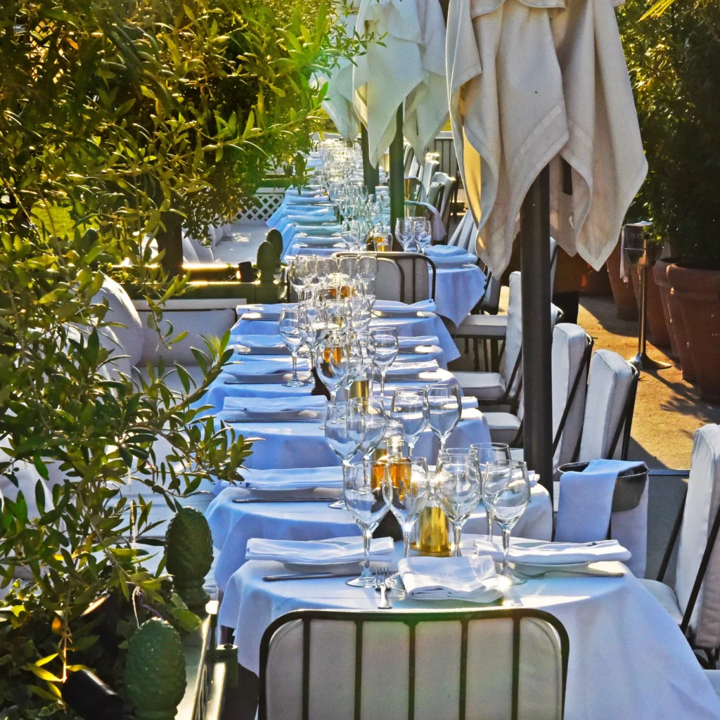 Elegant dining tables arranged on the Loulou Paris terrace