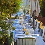 Elegant dining tables arranged on the Loulou Paris terrace
