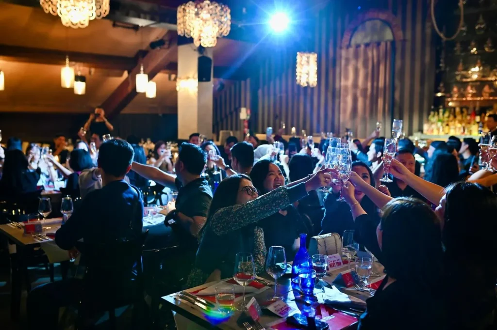Guests enjoying dinner and entertainment at Maison Milano