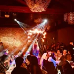 Guests watching a live dinner show at Maison Milano