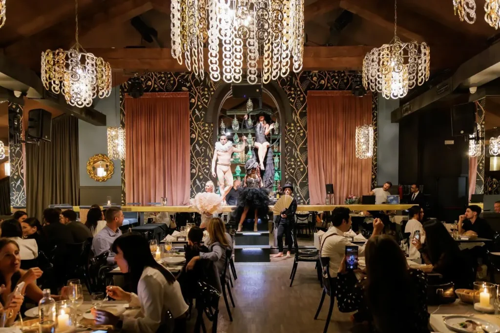 Guests watching a live performance during dinner at Maison Milano