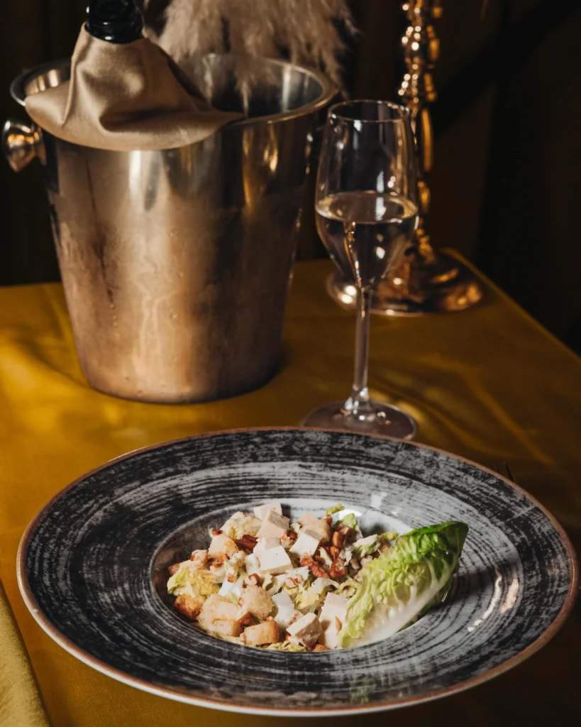 Gourmet dish presented on a plate at Maison Milano
