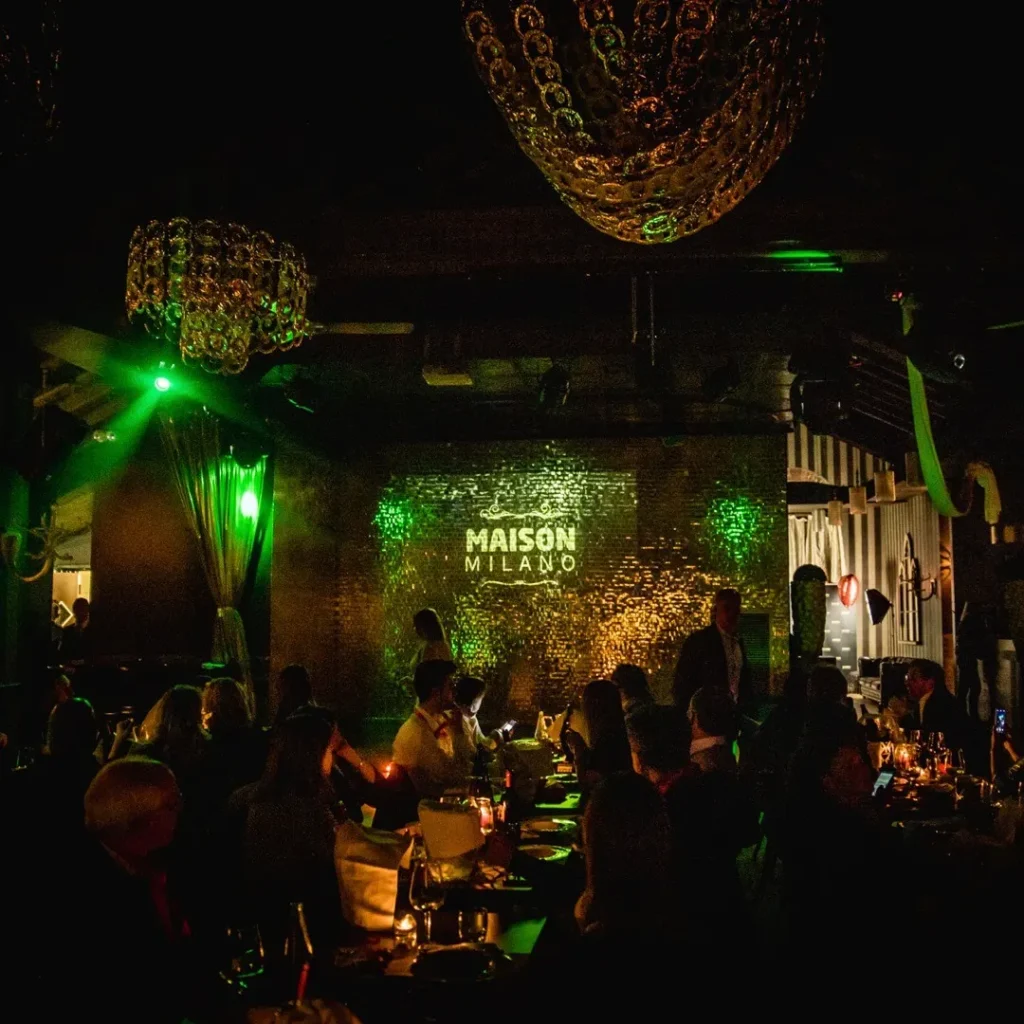 Guests enjoying the lively nightlife atmosphere at Maison Milano