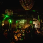 Guests enjoying the lively nightlife atmosphere at Maison Milano