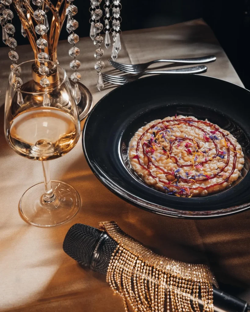 Pasta dish served with wine at Maison Milano