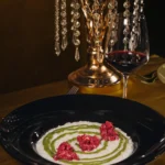 Artfully plated dish served at Maison Milano