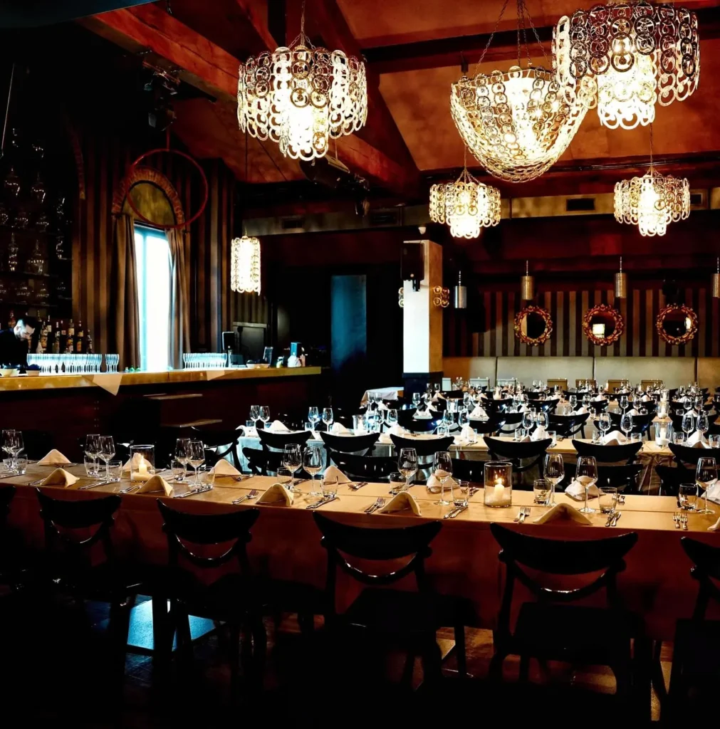 Elegant restaurant interior with chandeliers at Maison Milano