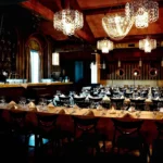 Elegant restaurant interior with chandeliers at Maison Milano