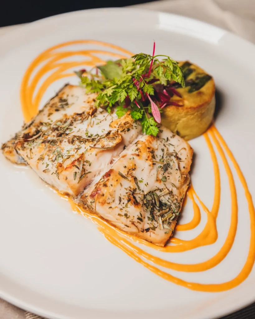Plated seafood dish served at Maison Milano