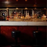 Dark and elegant bar area inside Matignon Paris