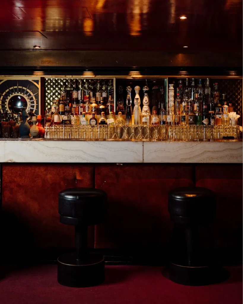 Dark and elegant bar area inside Matignon Paris