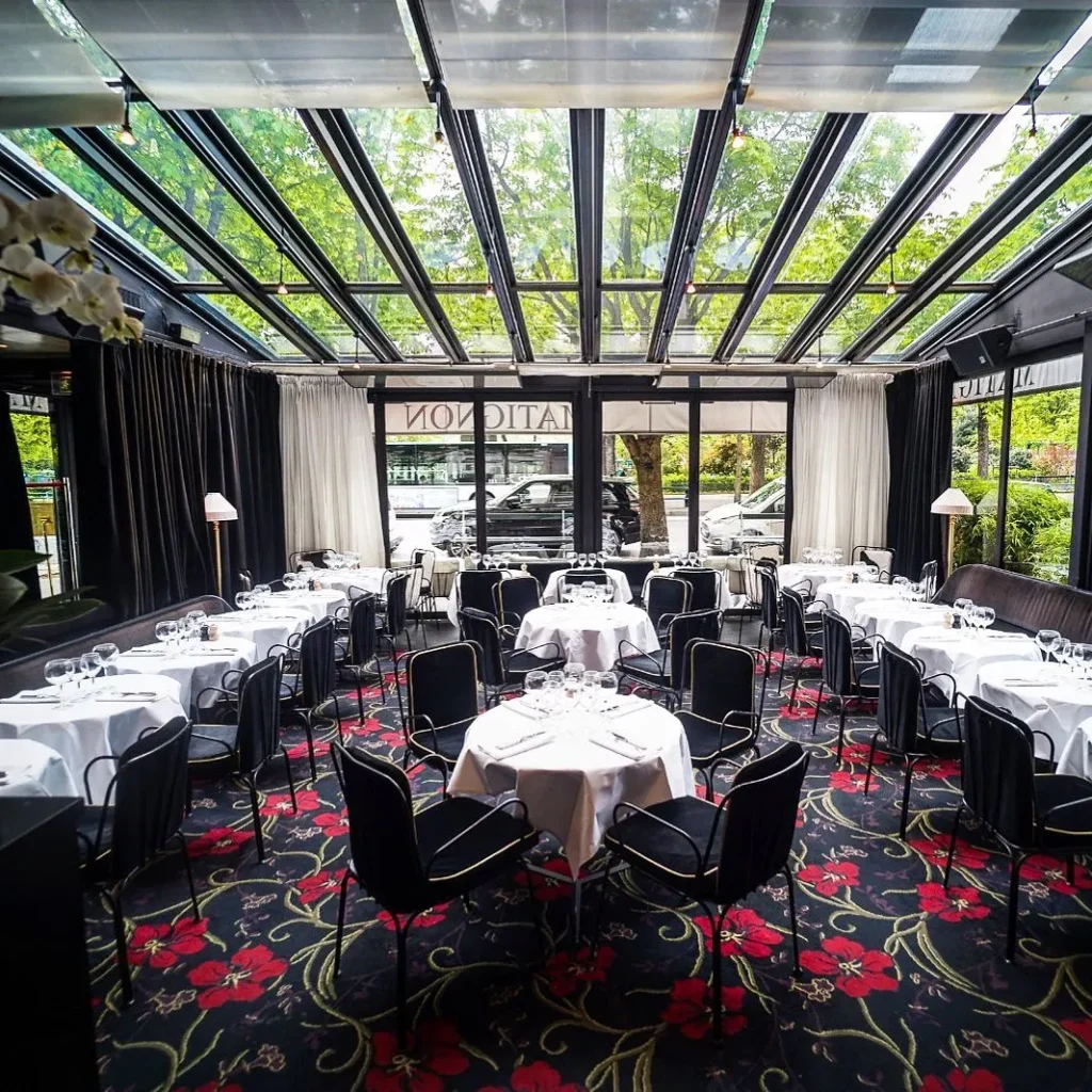 Elegant glass-roofed dining room at Matignon Paris