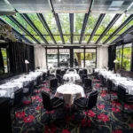 Elegant glass-roofed dining room at Matignon Paris