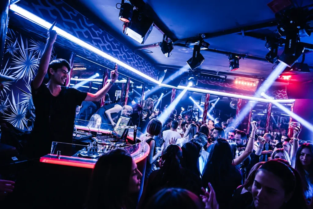 DJ performing to a crowd inside Matignon Paris