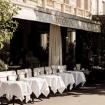 Outdoor tables arranged outside Matignon Paris restaurant