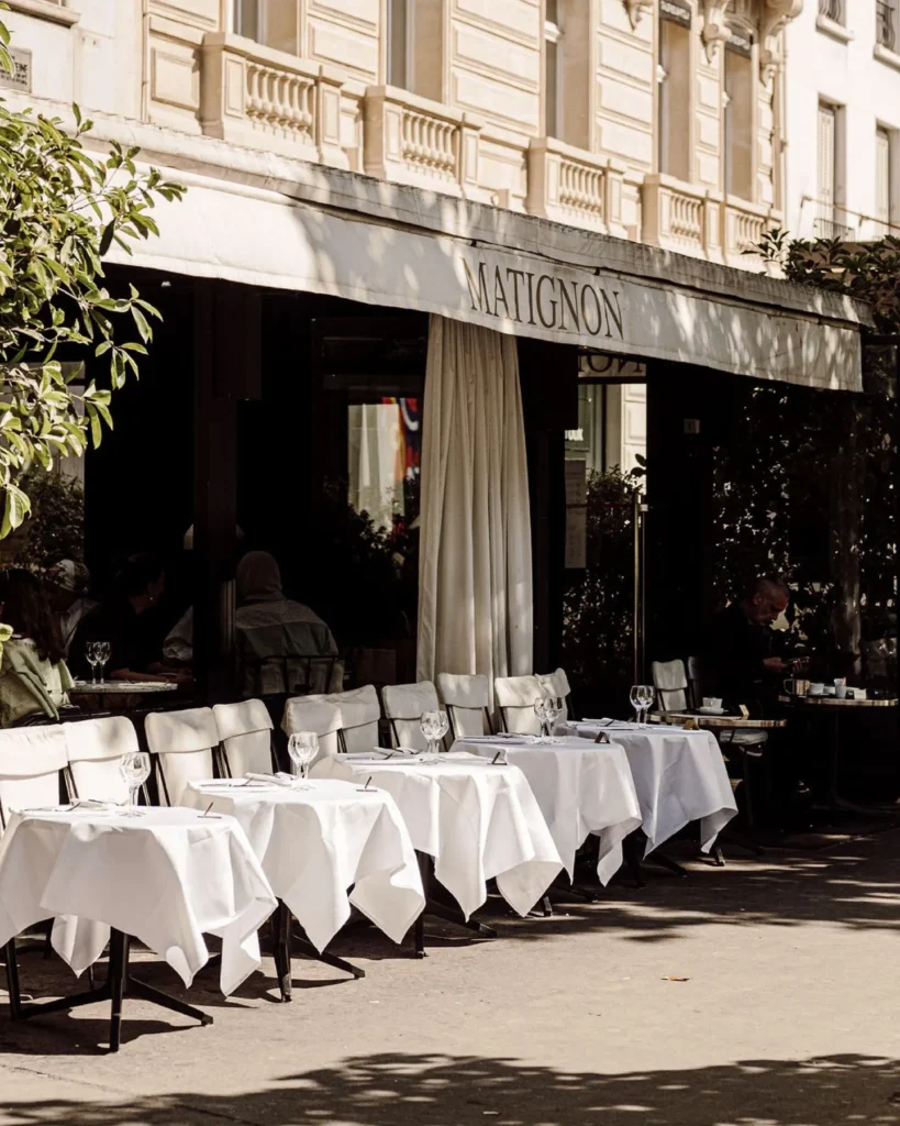 Outdoor tables arranged outside Matignon Paris restaurant
