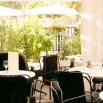 Bright garden-facing dining area at Matignon Paris