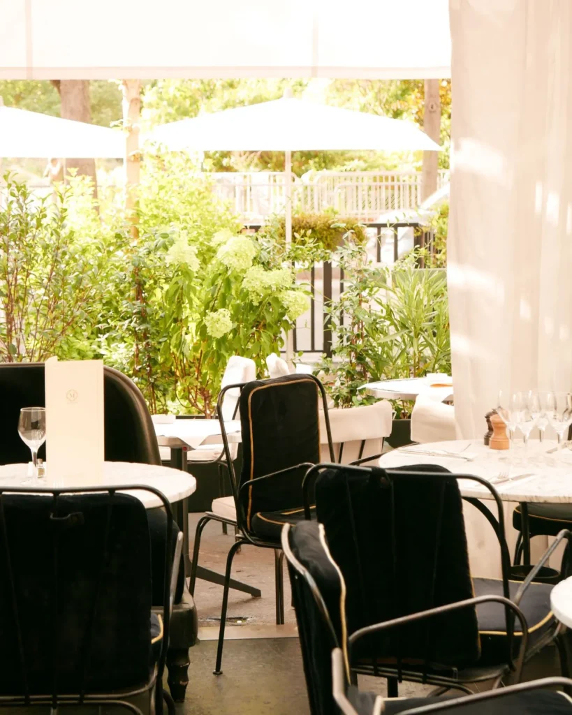 Bright garden-facing dining area at Matignon Paris