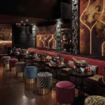 Elegant lounge area with colorful seating at Matignon Paris