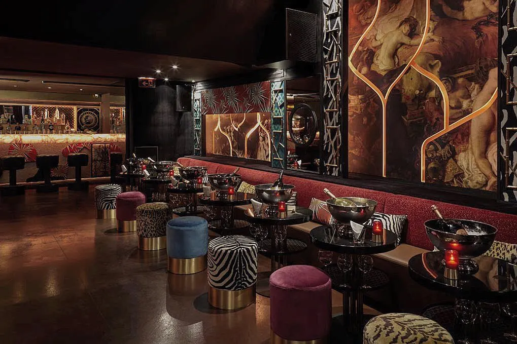 Elegant lounge area with colorful seating at Matignon Paris