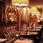 Elegant restaurant interior with candlelit tables at Matignon Paris