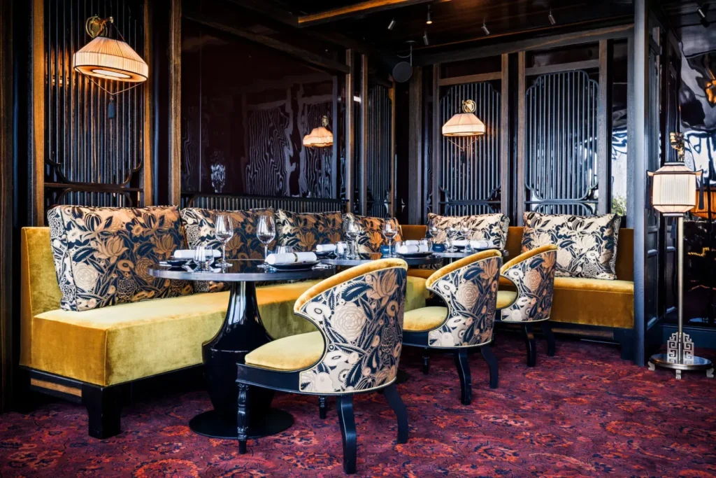Luxurious dining room at MUN Paris with patterned chairs