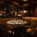 Elegant dark-toned dining room at MUN Paris