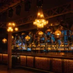Elegant bar with illuminated bottles and warm lighting at Pachamama Paris