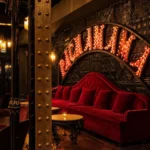 Red velvet lounge seating inside Pachamama Paris