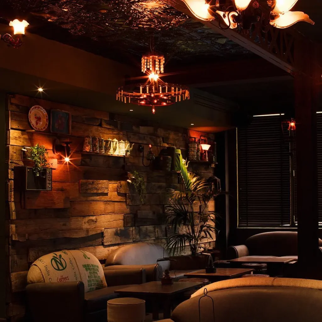 Cozy lounge seating with warm lighting inside Pachamama Paris