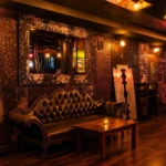 Warmly lit restaurant interior with leather seating at Pachamama Paris