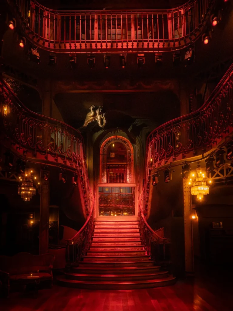 Dramatic illuminated staircase inside Pachamama Paris