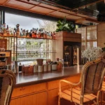 Warm wooden bar interior at Perruche Paris