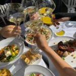 Guests enjoying food and drinks at Perruche Paris