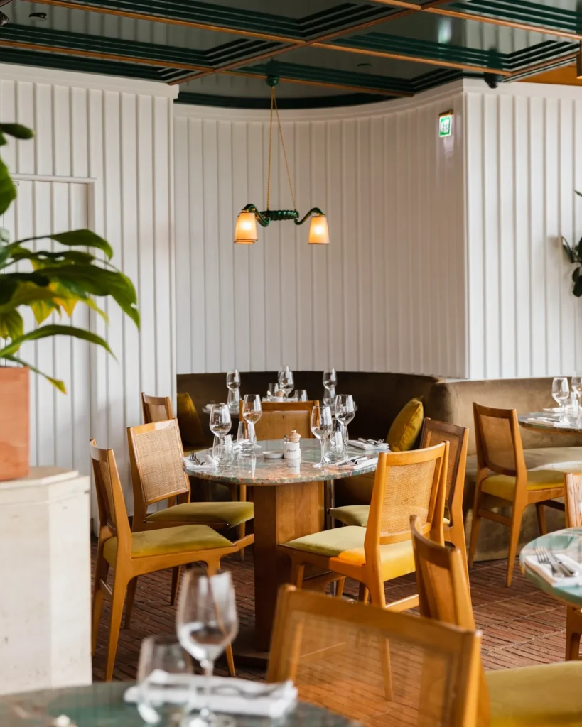 Warm wooden bar interior at Perruche Paris