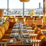 Elegant dining room with warm wooden interiors at Perruche Paris