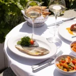 Food and drinks served on the terrace at Perruche Paris
