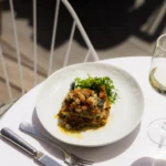 Gourmet dish served at Perruche Paris