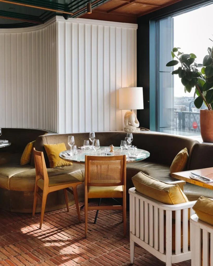 Elegant lounge seating inside Perruche Paris