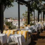 Outdoor terrace seating at Perruche Paris overlooking the city