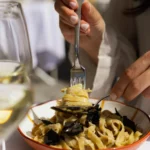 Pasta dish being served at Perruche Paris